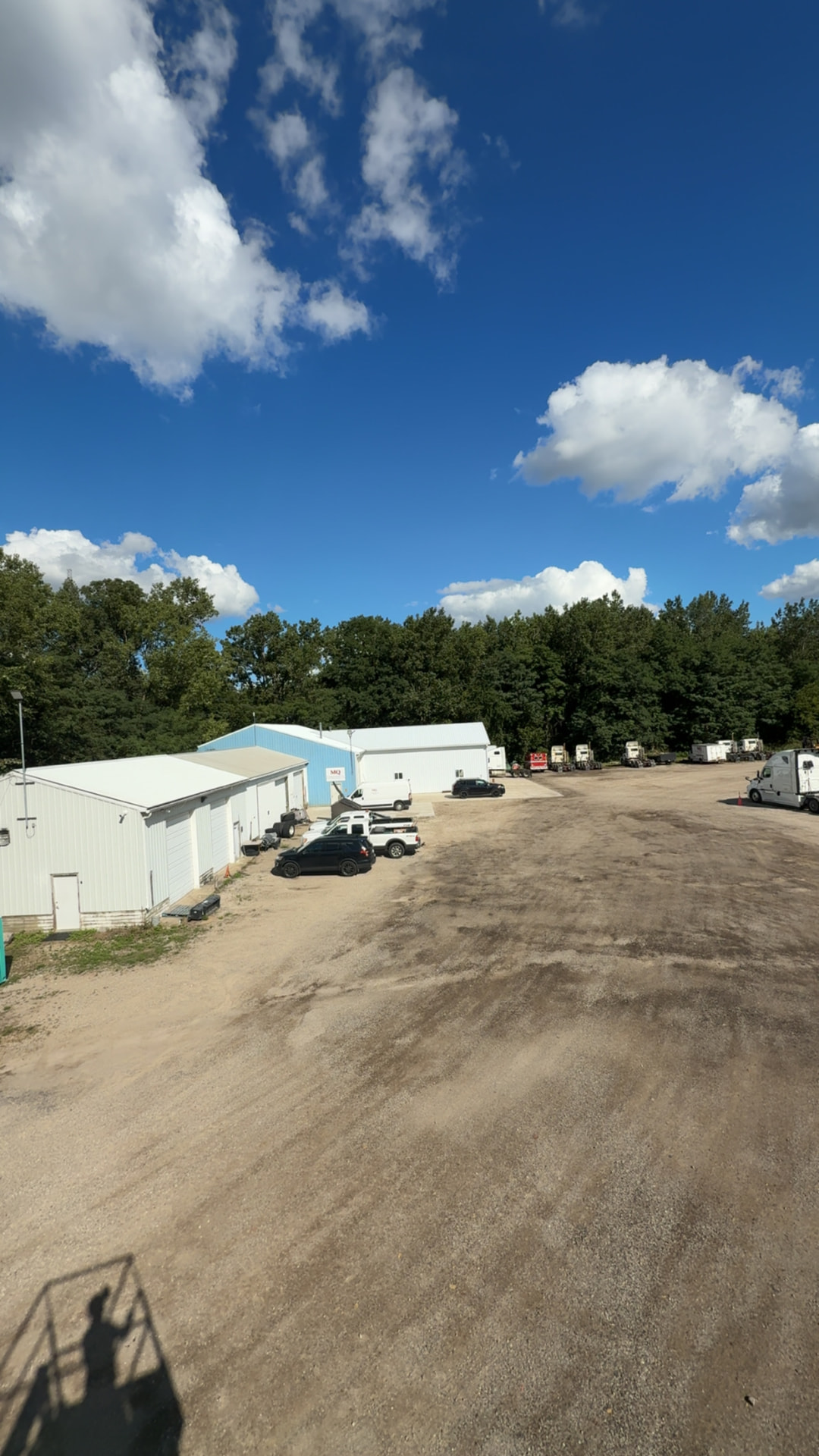 Yard with parked tractors and trailers