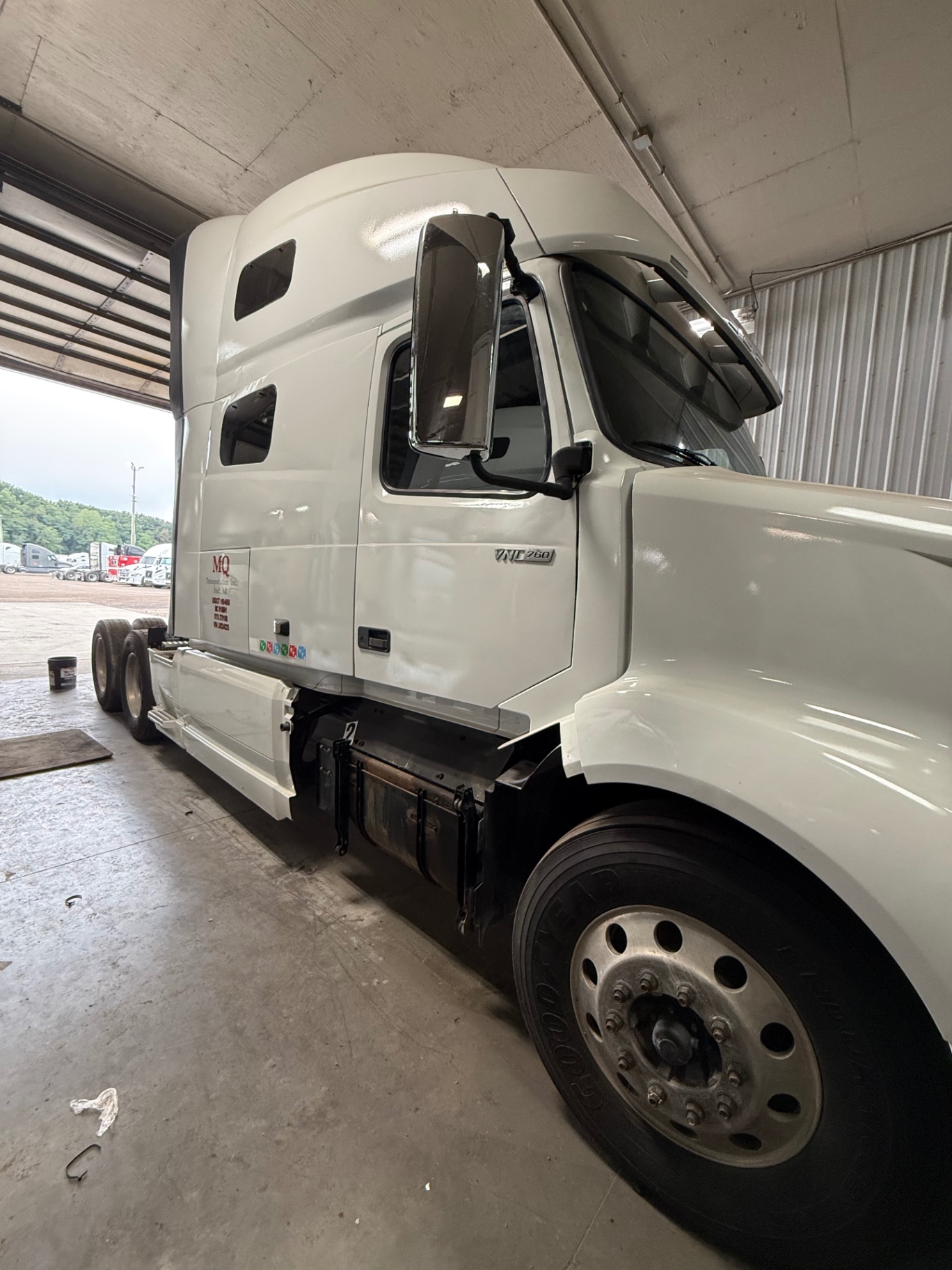 Side of the restored Volvo VNL with fresh paint and lettering