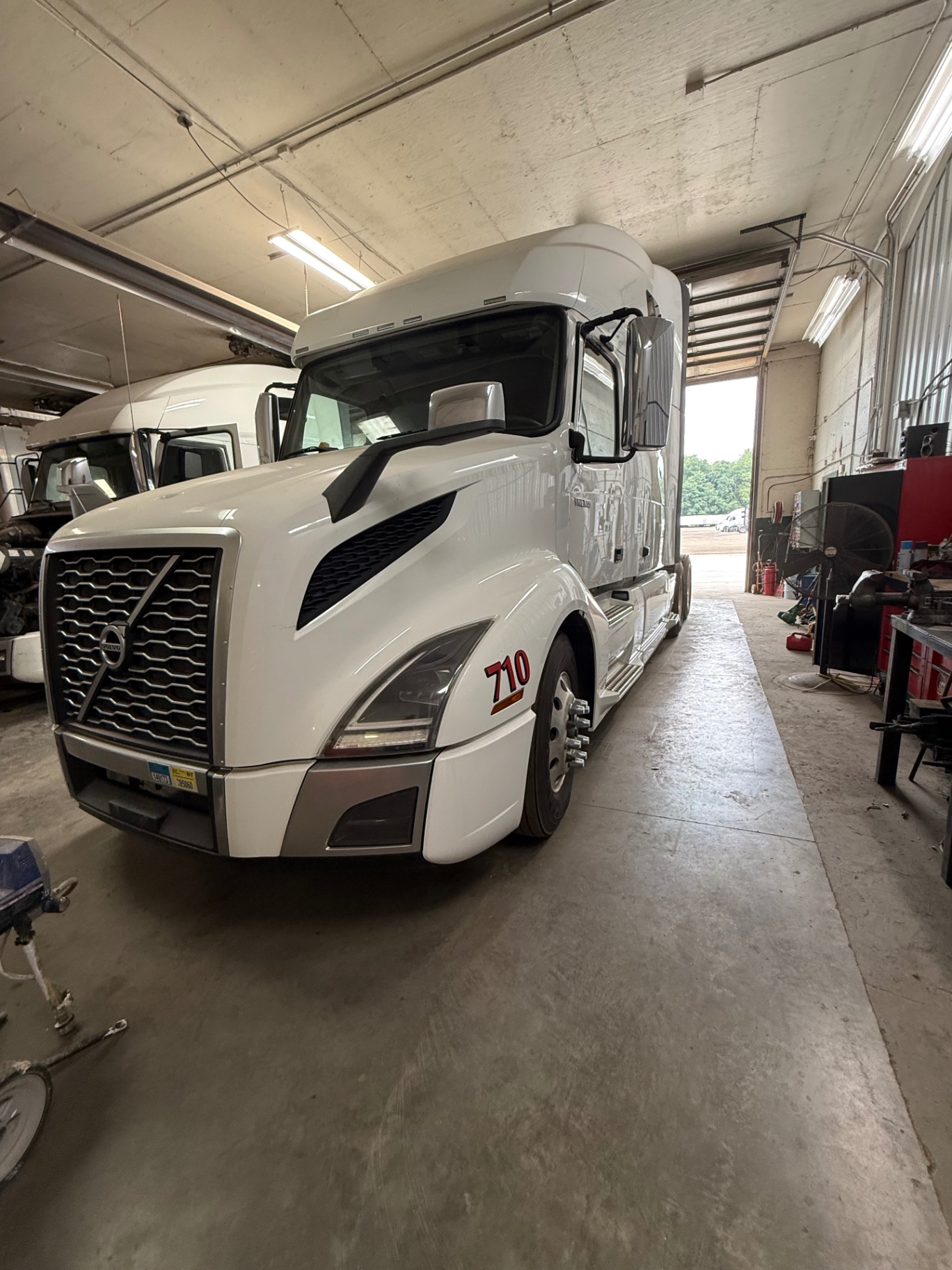 Finished Volvo VNL in the shop bay after restoration