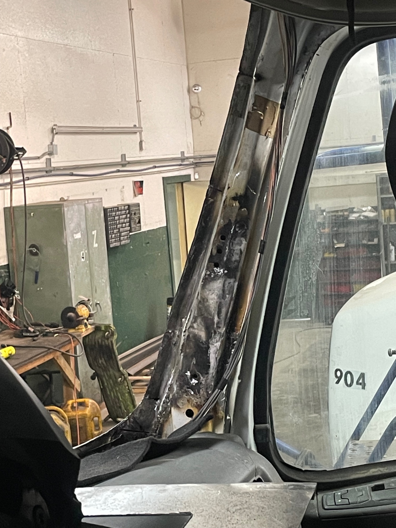 Burned and cut-away pillar structure inside the Volvo cab